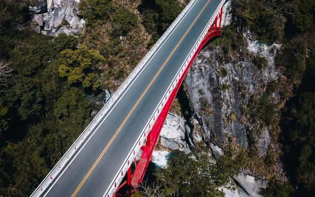 Aerial view of a red bridge crossing Taroko Gorge in Taiwan