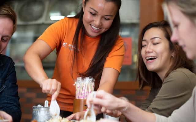Pedal Taiwan guide and guests eating lu rou fan at a local Taipei restaurant
