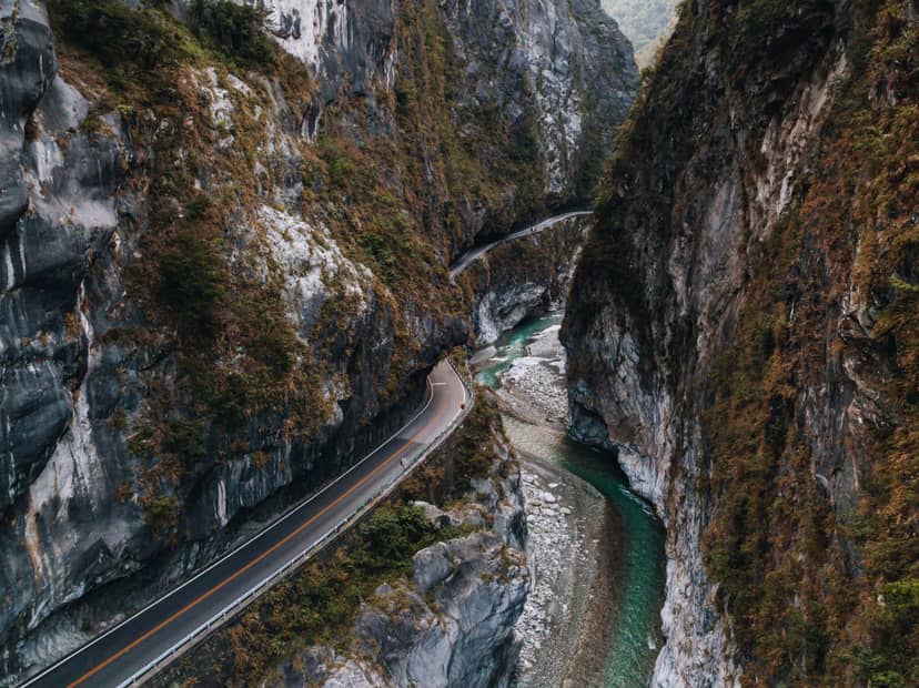 Aerial view of the Taiwan KOM cycling route, road cut into Taroko Gorge marble cliffs above the turquoise Liwu River