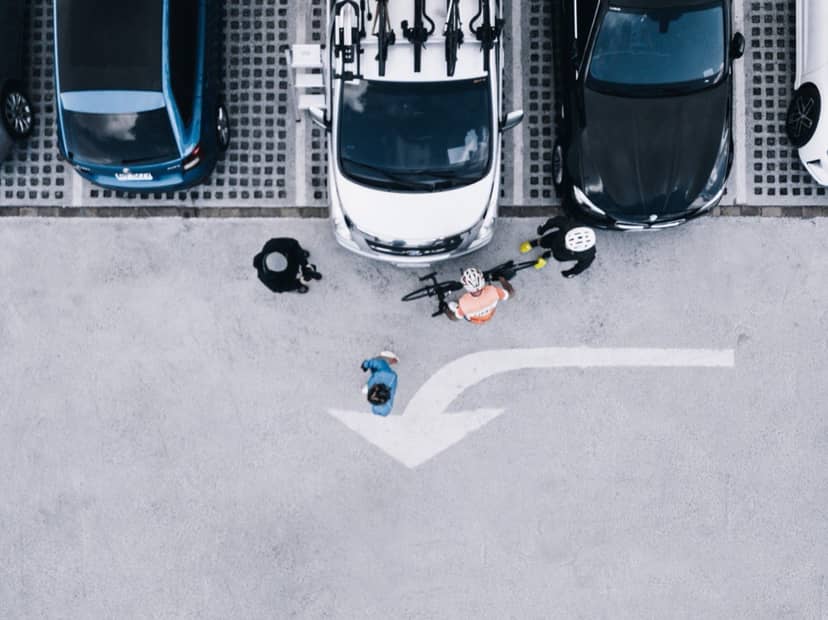 Aerial view of Pedal Taiwan's support vehicle with bike rack, cyclists preparing their bikes before a ride