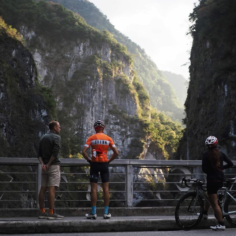 Cyclists looking up at the marble walls of Taroko Gorge in Taiwan
